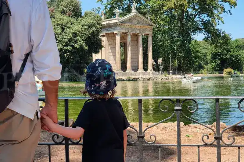 Children running in villa borghese gardens