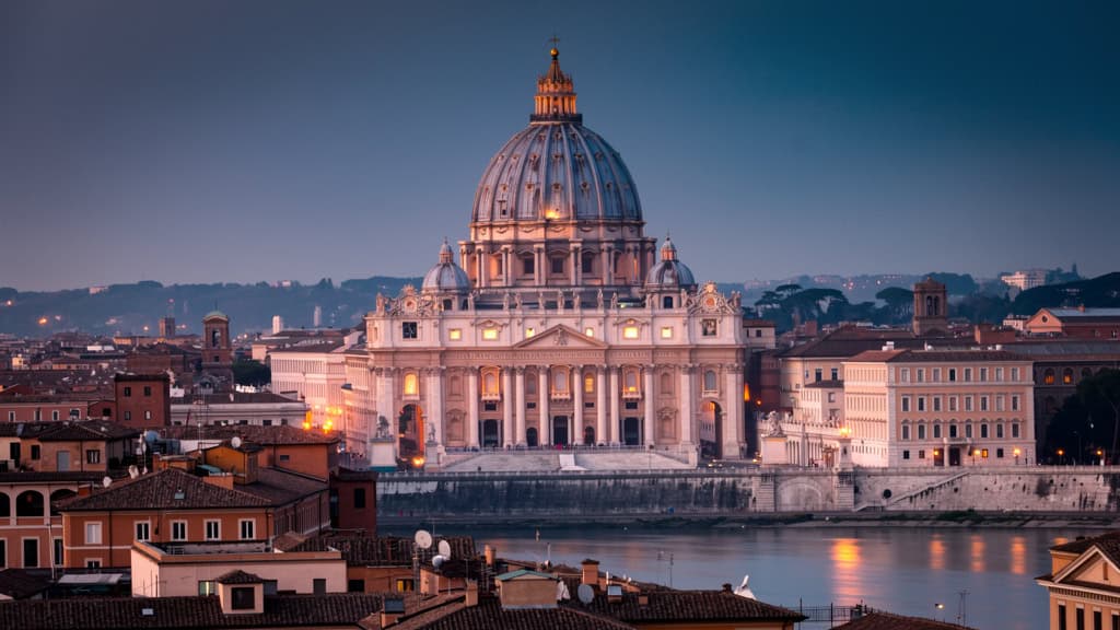Saint Peter's Basilica dome at dusk over Rome