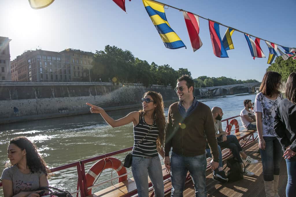 Unforgettable honeymoon moment on a sunset tiber river cruise.